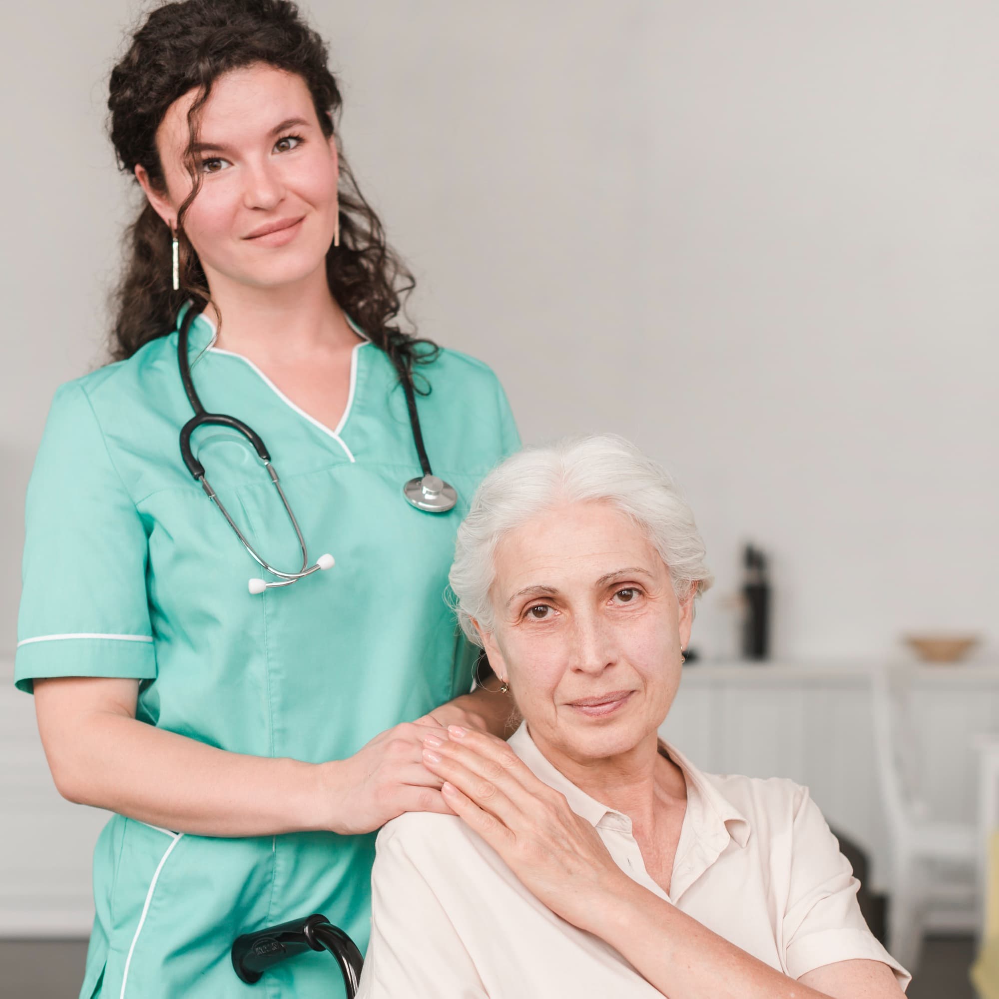 Elderly woman being cared for by professional